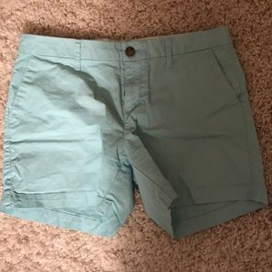 Light blue mid-thigh shorts